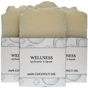 Three bars of just soap100% coconut oil, one in front of two others, no background