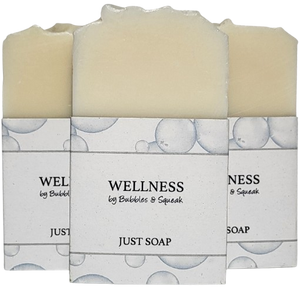 Three bars of just soap, one in front of two others, no background