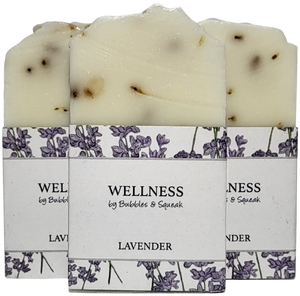 Three bars of just soap lavender, one in front of two others, no background