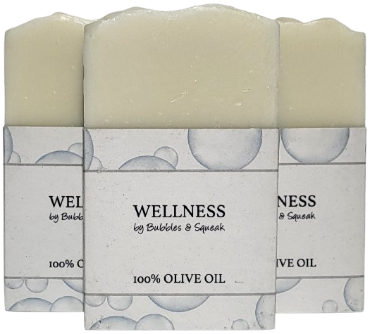 Three bars of just soap 100% olive oil, one in front of two others, no background