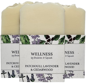 Three bars of just soap patchouli lavender and cedarwood, one in front of two others, no background