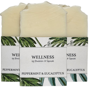 Three bars of just soap peppermint and eucalyptus, one in front of two others, no background