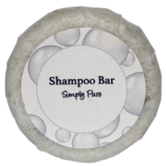 A round bar of simply pure shampoo on a blank background